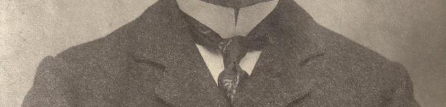 Detail of photograph of O'Kelly highlighting his shirt and tie