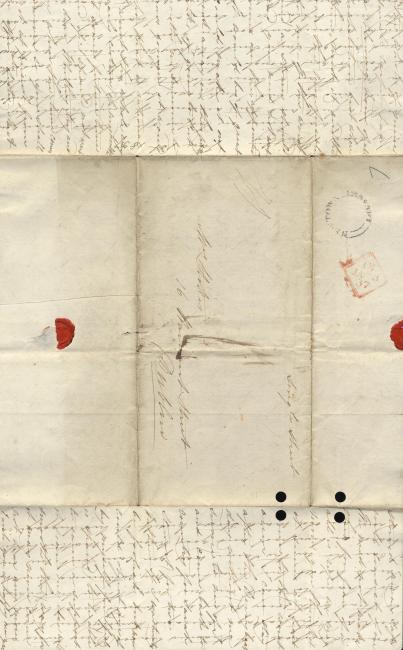 An open letter showing a wax seal and parts of the letter's handwritten contents. Writing is in a cross-hatch style.